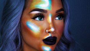 The Latest Makeup Trends for this Spring girl wearing metallic multi-color highlighter