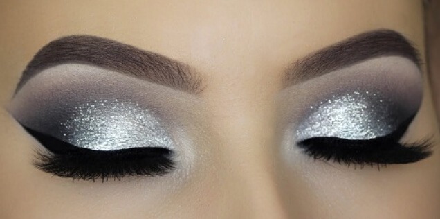 glitter eye make up with cut crease long lashes and perfect brows