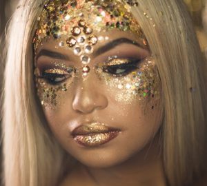 woman with golden metallic makeup