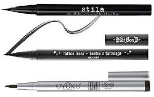 liquid eye liners with open caps on white background