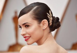 Wedding Makeup Trends This Year bride weating makeup and red lipstick