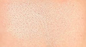 Tarte Aspyn Ovard Eye & Cheek Palette: Review and Swatches Pure Soul Highlighter swatch on skin Tarte Aspyn Onvard eye and cheek palette