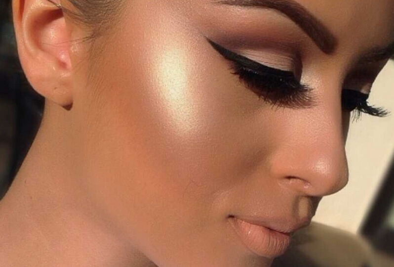 girl's face with highlighter on cheekbones