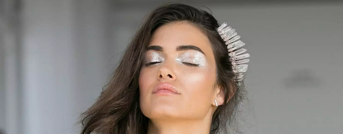 Wedding makeup with glitter and metallic accents