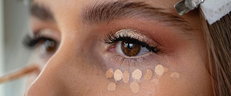 Lady with the water-based concealer applied under the eyes