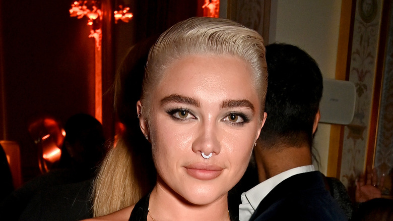 Florence Pugh thick brows slicked back hair