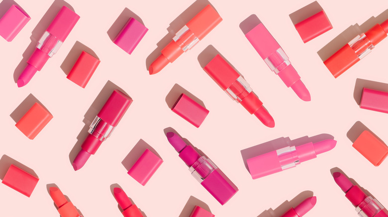 scattered pink and red lipsticks 