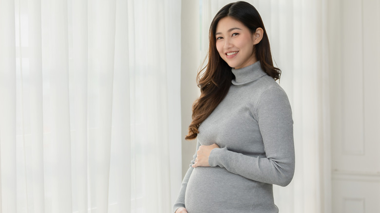 A smiling pregnant woman