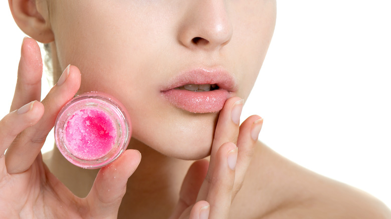 Woman using lip sugar scrub