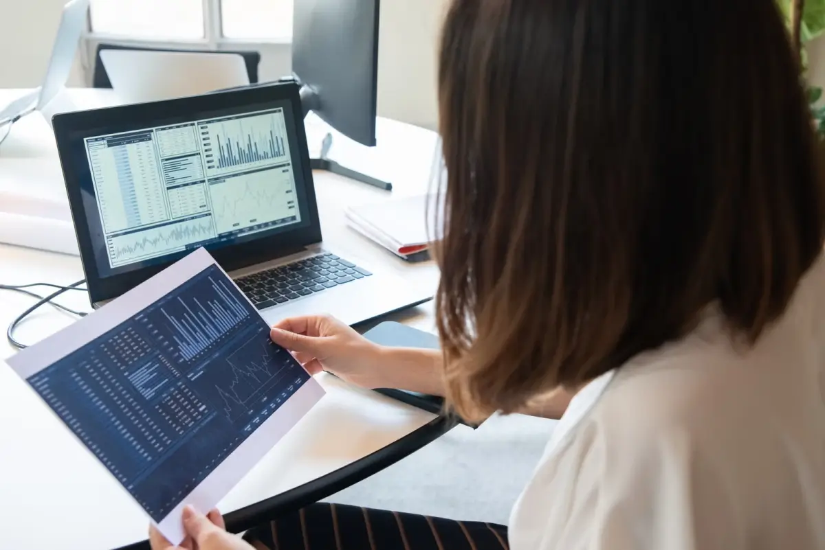 Woman reviewing financial charts and information